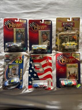 Collectible NASCAR cars- Blue, Yellow, Black, Red, White 6 individual packs